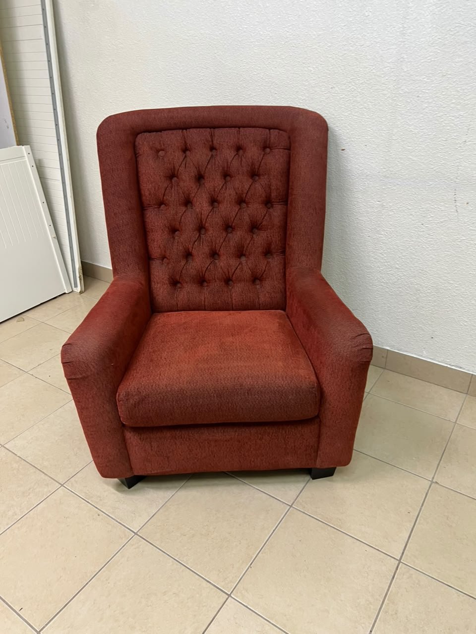 A classic-style armchair featuring a high, button-tufted backrest, upholstered in textured dark red fabric, and accented with metal nailhead trim along the edges. - Image 7