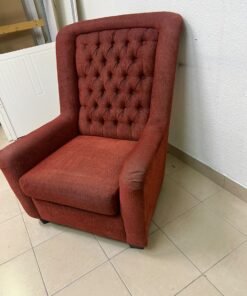 A classic-style armchair featuring a high, button-tufted backrest, upholstered in textured dark red fabric, and accented with metal nailhead trim along the edges. - Image 10