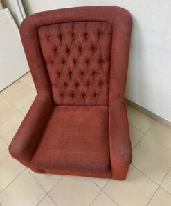 A classic-style armchair featuring a high, button-tufted backrest, upholstered in textured dark red fabric, and accented with metal nailhead trim along the edges. - Image 11