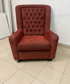 A classic-style armchair featuring a high, button-tufted backrest, upholstered in textured dark red fabric, and accented with metal nailhead trim along the edges. - Image 2