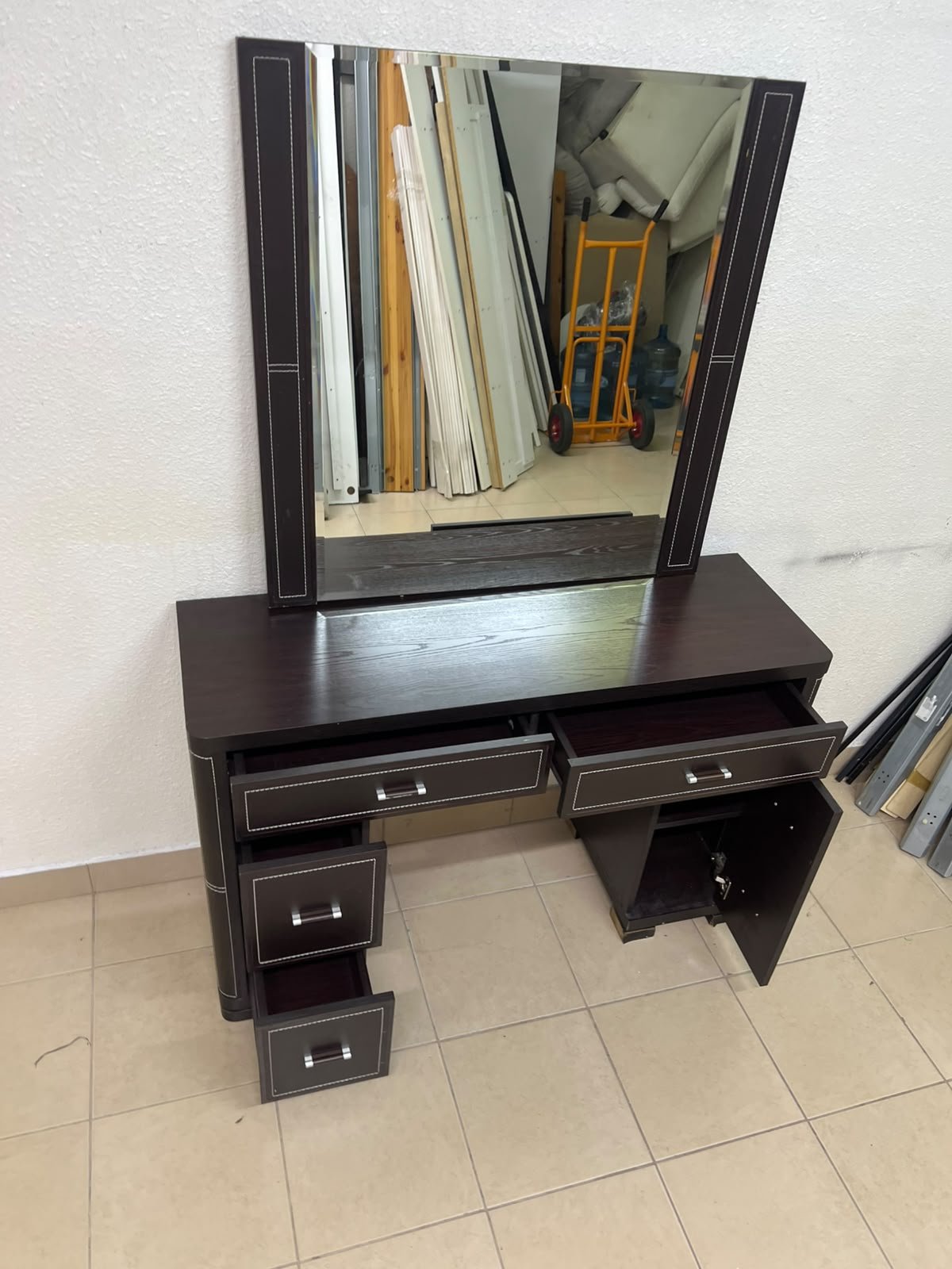 The image shows a brown wooden vanity table with an attached mirror and multiple drawers. - Image 3