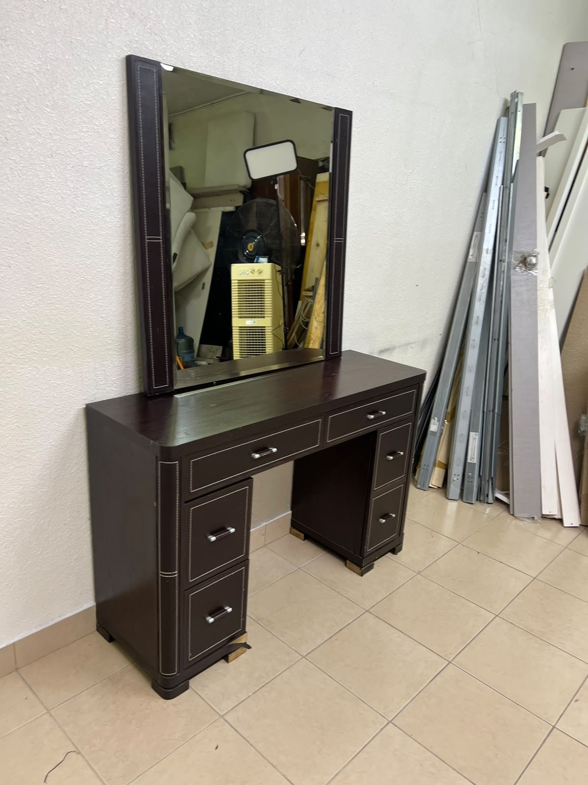 The image shows a brown wooden vanity table with an attached mirror and multiple drawers. - Image 4