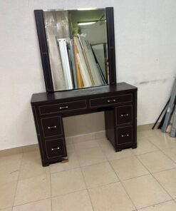 The image shows a brown wooden vanity table with an attached mirror and multiple drawers. - Image 16