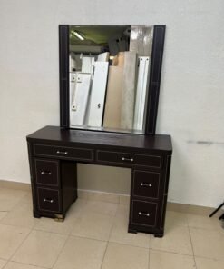 The image shows a brown wooden vanity table with an attached mirror and multiple drawers. - Image 12