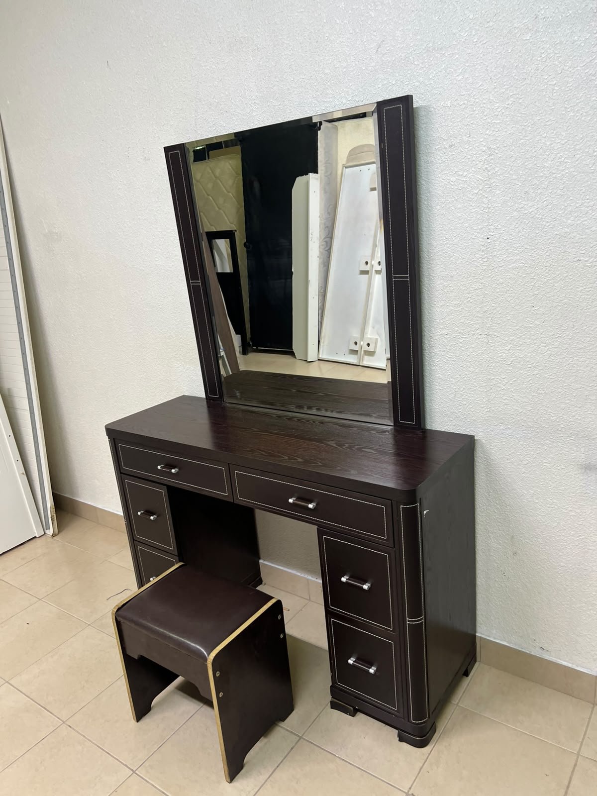 The image shows a brown wooden vanity table with an attached mirror and multiple drawers. - Image 10