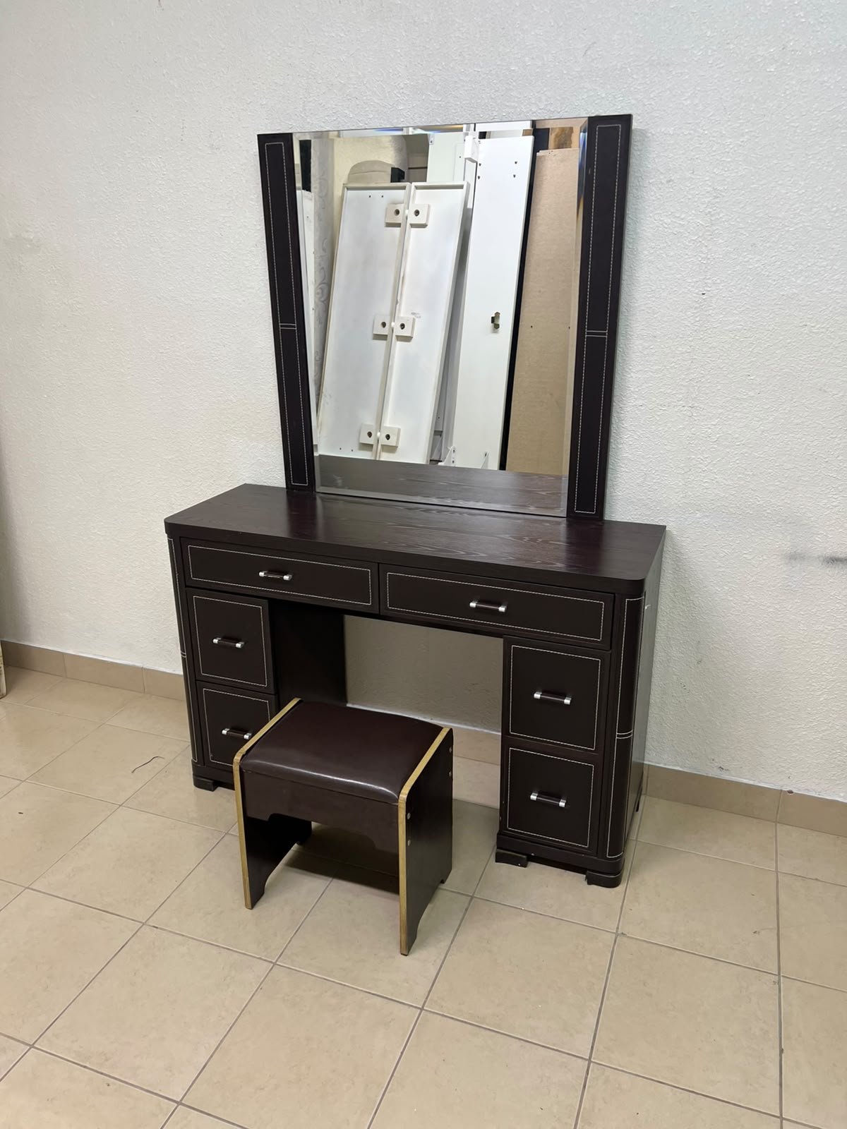 The image shows a brown wooden vanity table with an attached mirror and multiple drawers. - Image 17