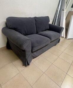 The IKEA EKTORP 2-seat sofa features a dark gray slipcover, a classic design, and comfortable, removable, and washable seat cushions. - Image 2