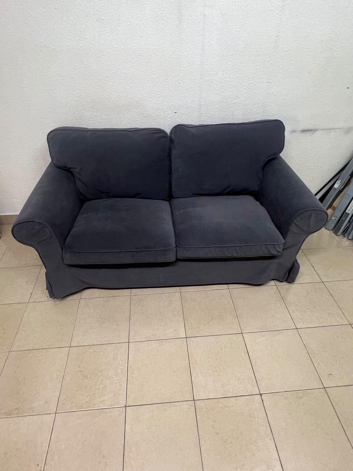 The IKEA EKTORP 2-seat sofa features a dark gray slipcover, a classic design, and comfortable, removable, and washable seat cushions. - Image 3