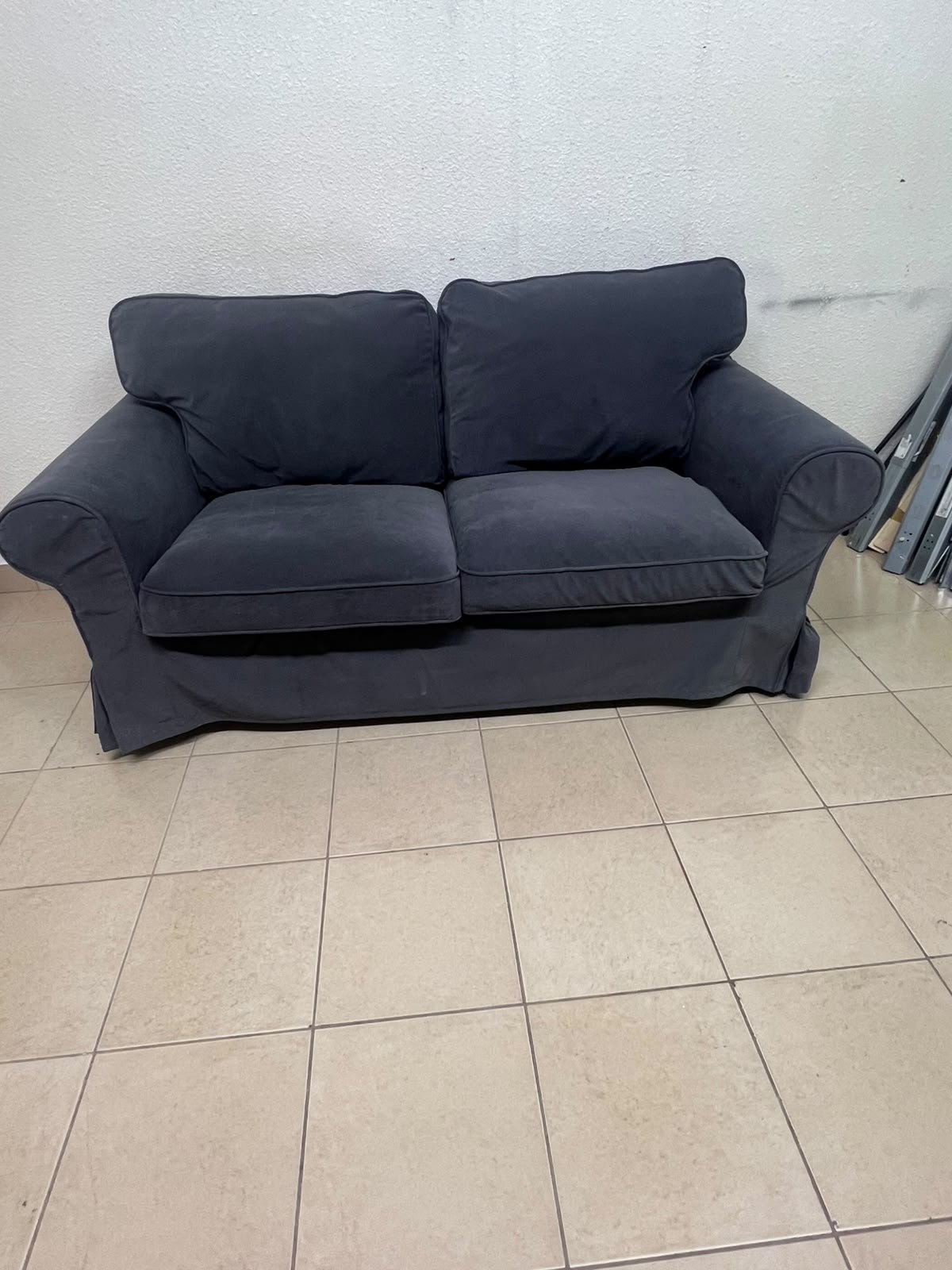The IKEA EKTORP 2-seat sofa features a dark gray slipcover, a classic design, and comfortable, removable, and washable seat cushions. - Image 4