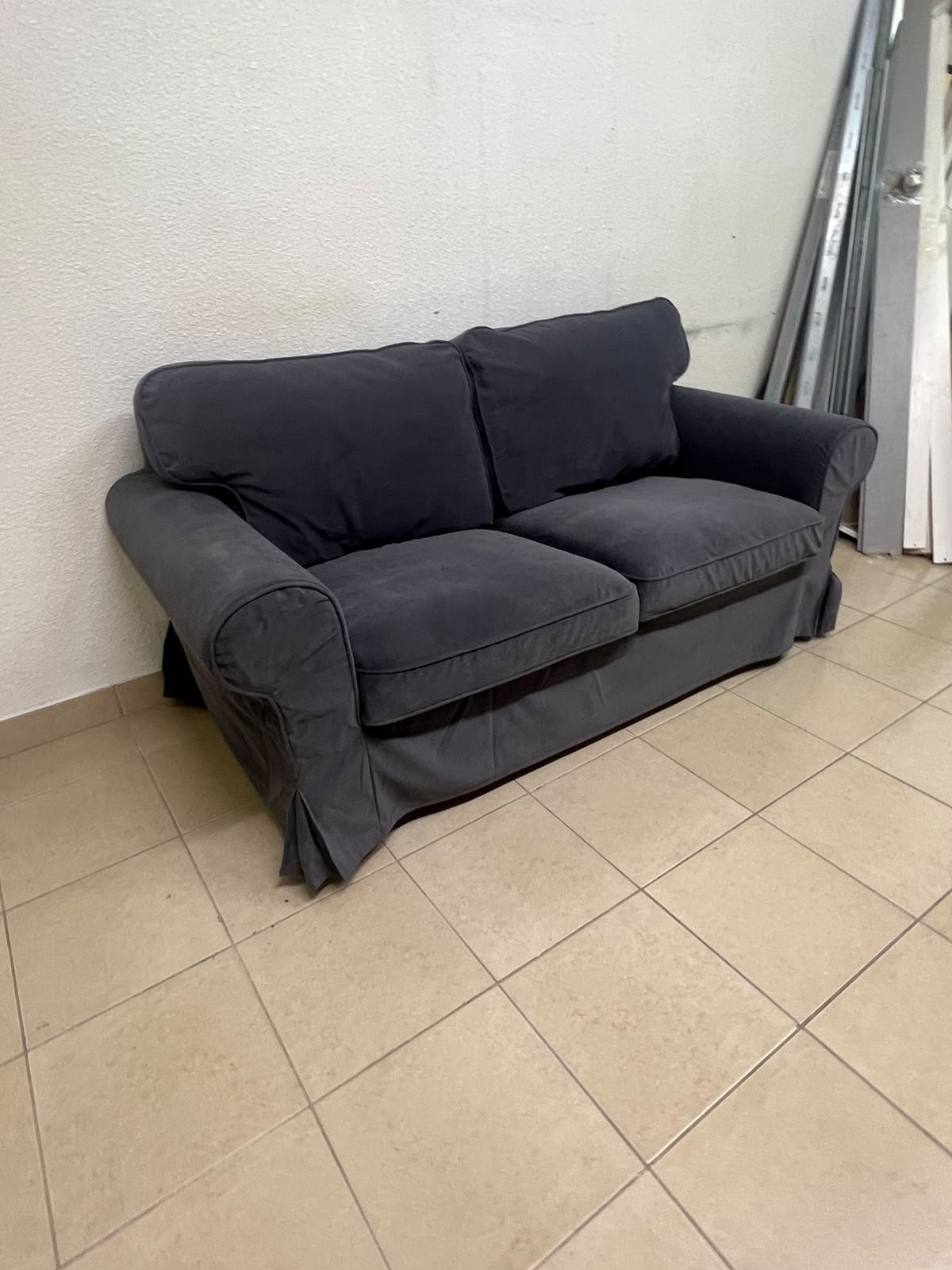The IKEA EKTORP 2-seat sofa features a dark gray slipcover, a classic design, and comfortable, removable, and washable seat cushions. - Image 6