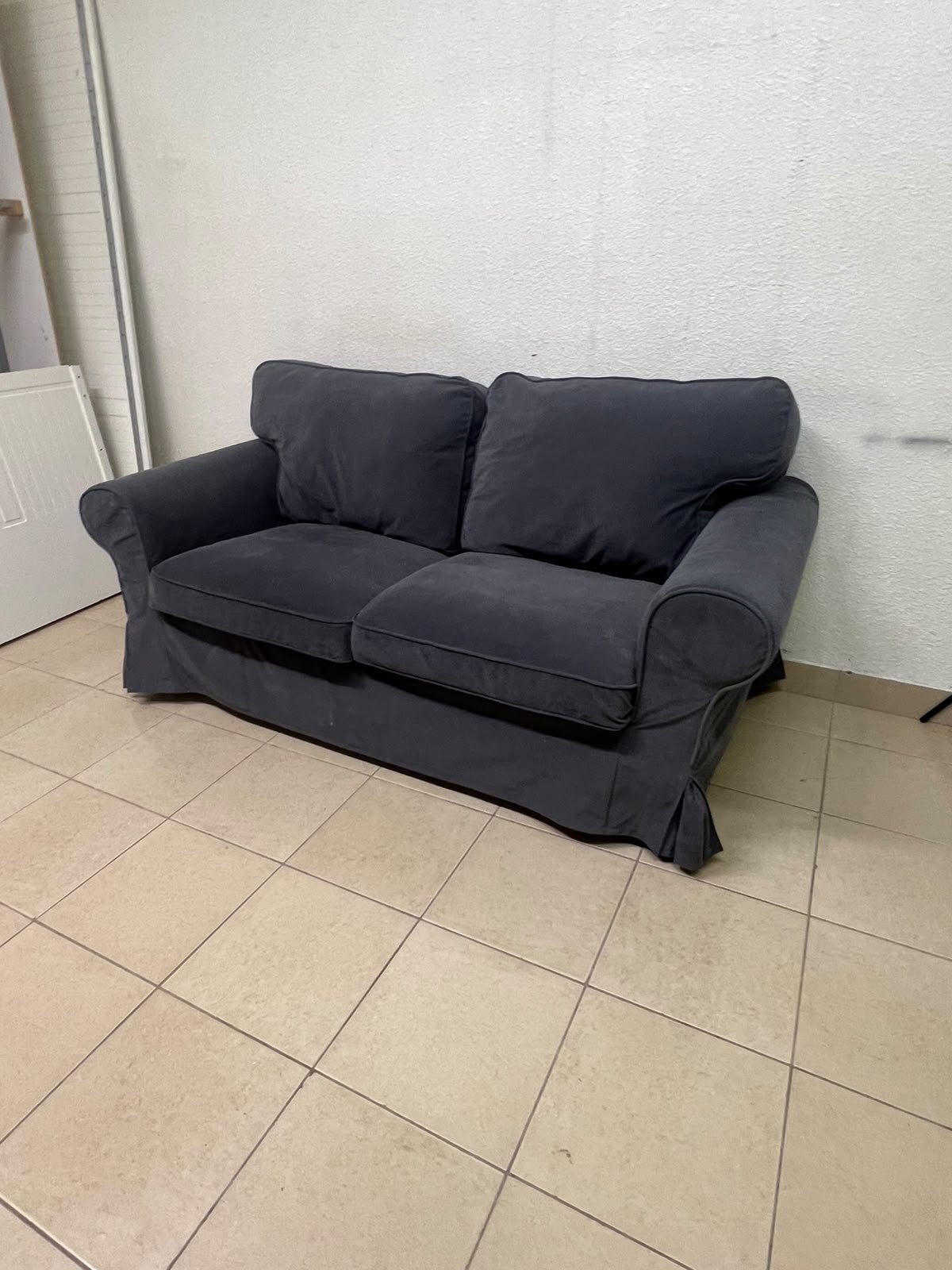 The IKEA EKTORP 2-seat sofa features a dark gray slipcover, a classic design, and comfortable, removable, and washable seat cushions. - Image 8
