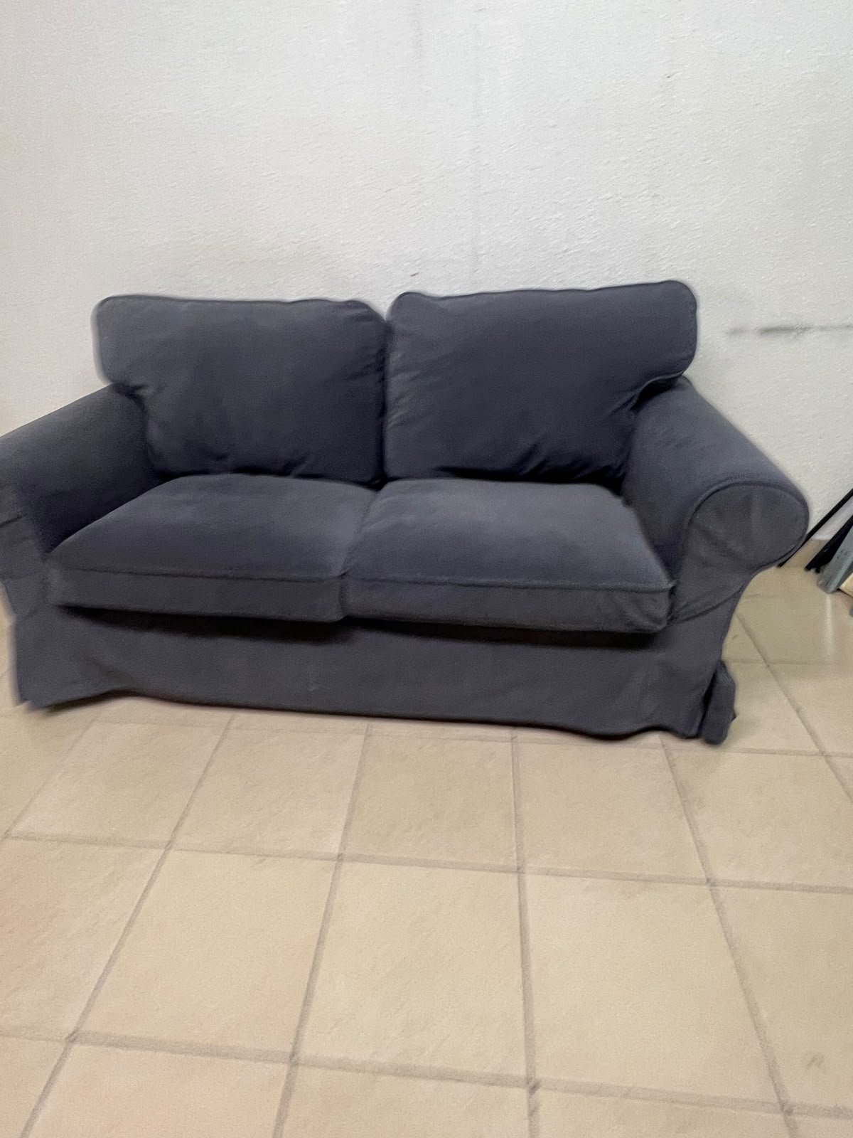 The IKEA EKTORP 2-seat sofa features a dark gray slipcover, a classic design, and comfortable, removable, and washable seat cushions. - Image 9