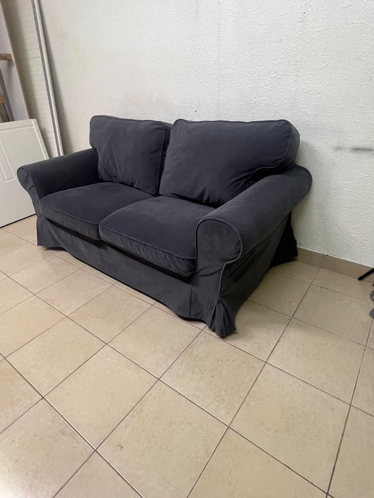 The IKEA EKTORP 2-seat sofa features a dark gray slipcover, a classic design, and comfortable, removable, and washable seat cushions. - Image 10