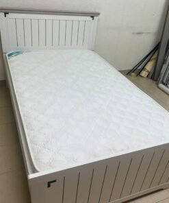 A white wooden single bed featuring a pull-out trundle bed underneath, with two matching padded mattresses. - Image 2