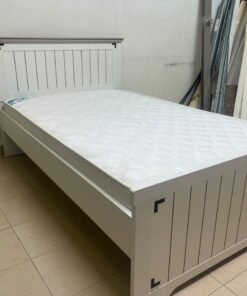 A white wooden single bed featuring a pull-out trundle bed underneath, with two matching padded mattresses. - Image 6