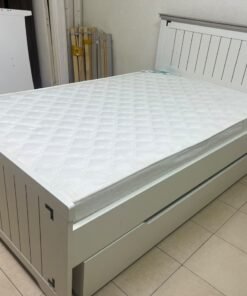 A white wooden single bed featuring a pull-out trundle bed underneath, with two matching padded mattresses. - Image 8