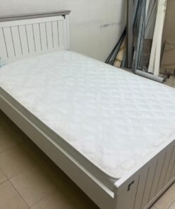 A white wooden single bed featuring a pull-out trundle bed underneath, with two matching padded mattresses. - Image 9