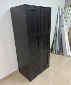 The RAKKESTAD two-door wardrobe from IKEA features a practical, simple design and measures approximately 79x176 cm; it comes in a black-brown finish. - Image 6