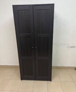 The RAKKESTAD two-door wardrobe from IKEA features a practical, simple design and measures approximately 79x176 cm; it comes in a black-brown finish. - Image 10
