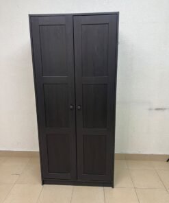 The RAKKESTAD two-door wardrobe from IKEA features a practical, simple design and measures approximately 79x176 cm; it comes in a black-brown finish.