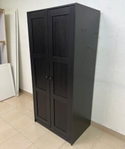 The RAKKESTAD two-door wardrobe from IKEA features a practical, simple design and measures approximately 79x176 cm; it comes in a black-brown finish. - Image 2