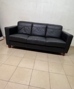 A modern three-seater black leather sofa featuring square armrests and wooden legs, resembling the IKEA "Skogaby" model. - Image 3