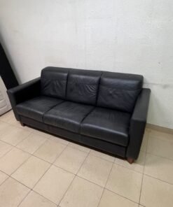 A modern three-seater black leather sofa featuring square armrests and wooden legs, resembling the IKEA "Skogaby" model. - Image 7
