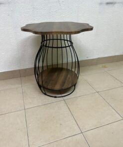 This modern two-tier side table features a wooden top with curved edges and a lower storage shelf enclosed by a black metal frame designed like a wire mesh cage. - Image 2