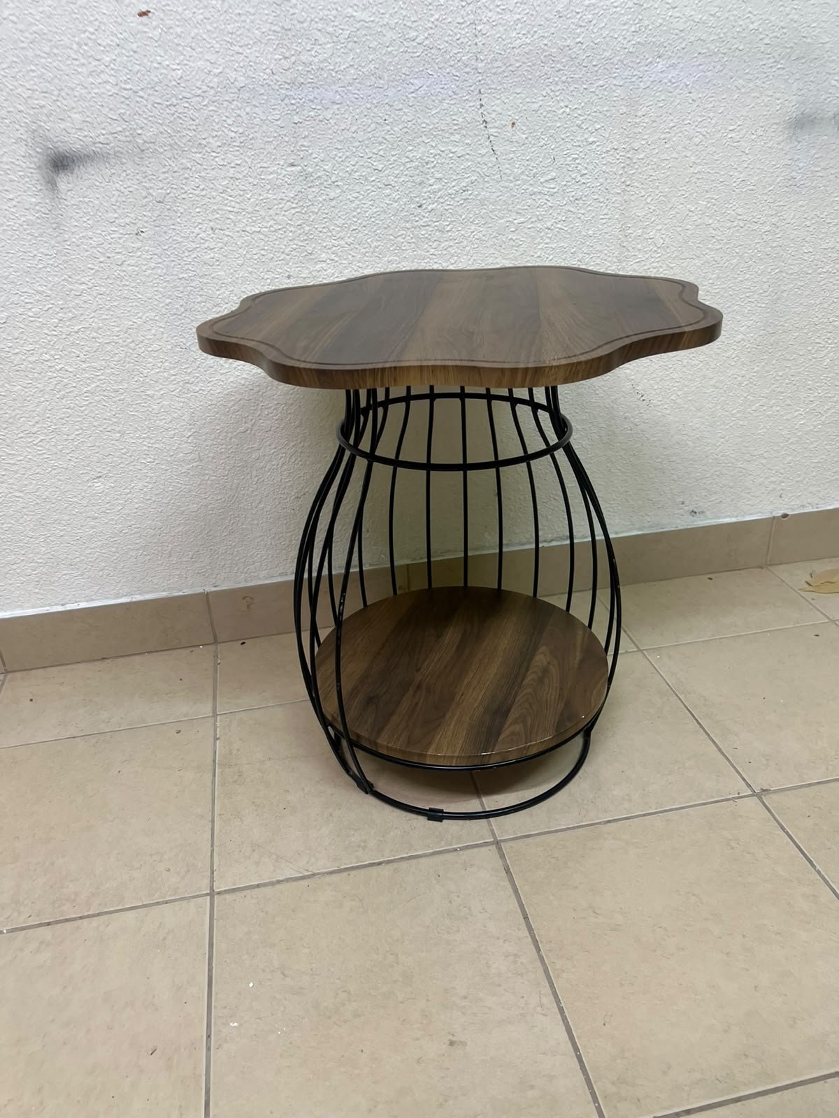 This modern two-tier side table features a wooden top with curved edges and a lower storage shelf enclosed by a black metal frame designed like a wire mesh cage. - Image 6