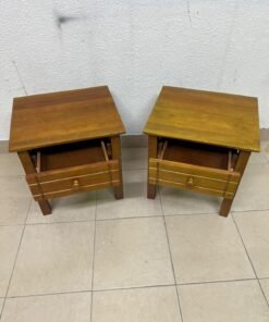 Two classic, medium-toned wooden side tables featuring a single drawer with a round wooden knob and classic grooved detailing on the frame. - Image 6