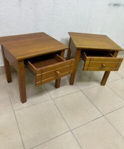Two classic, medium-toned wooden side tables featuring a single drawer with a round wooden knob and classic grooved detailing on the frame. - Image 9