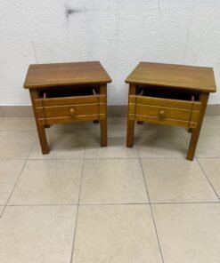 Two classic, medium-toned wooden side tables featuring a single drawer with a round wooden knob and classic grooved detailing on the frame. - Image 10