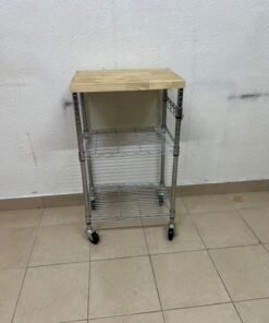 A multi-shelf kitchen cart made of chrome wire, featuring a light-colored wood top (butcher block style) and swivel casters. - Image 2