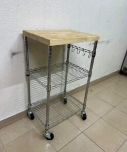 A multi-shelf kitchen cart made of chrome wire, featuring a light-colored wood top (butcher block style) and swivel casters. - Image 4