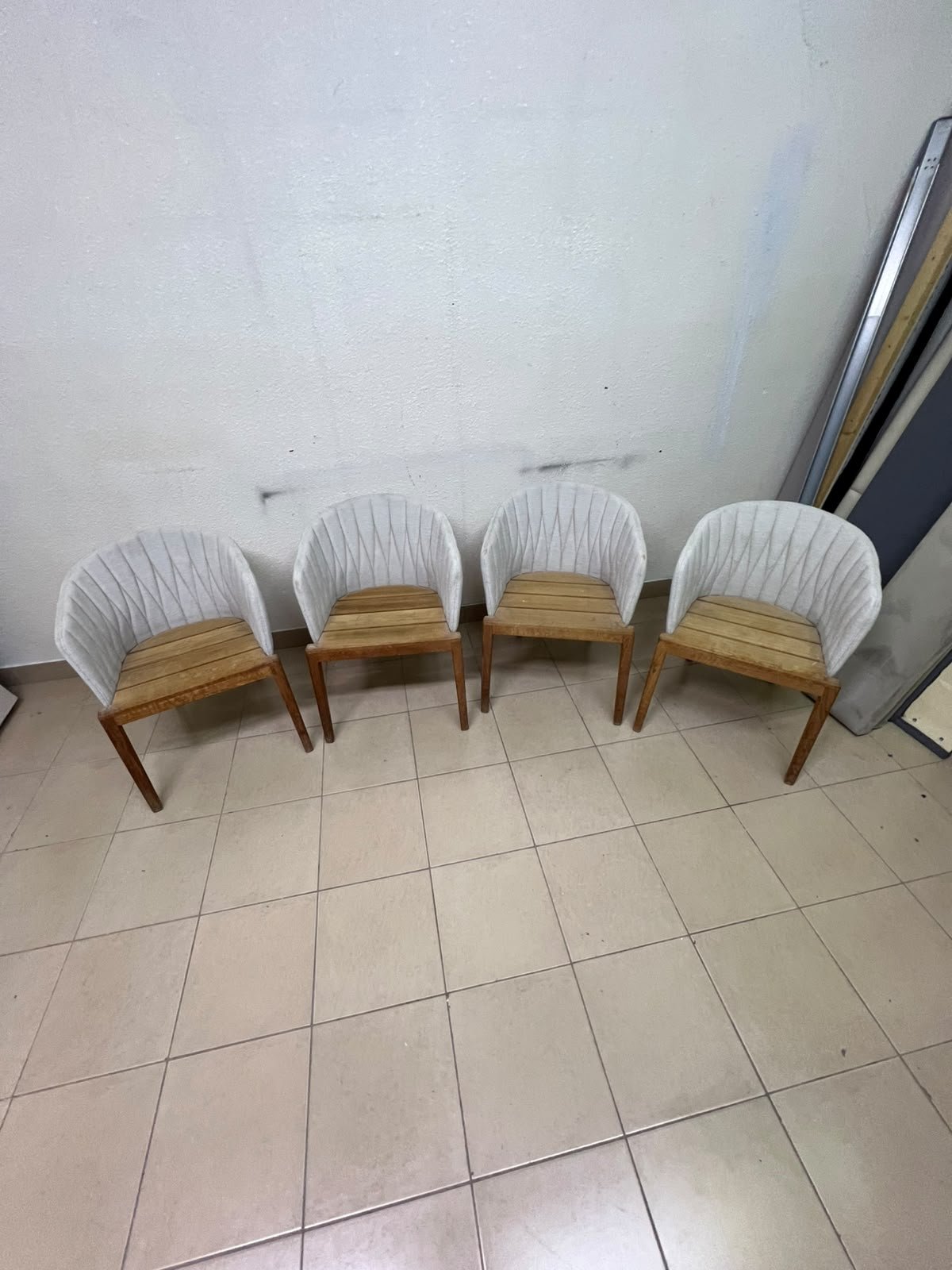The "Calypso" garden chair by Royal Botania, featuring a solid teak base and an upholstered backrest with a unique design incorporating vertical stitching. - Image 2