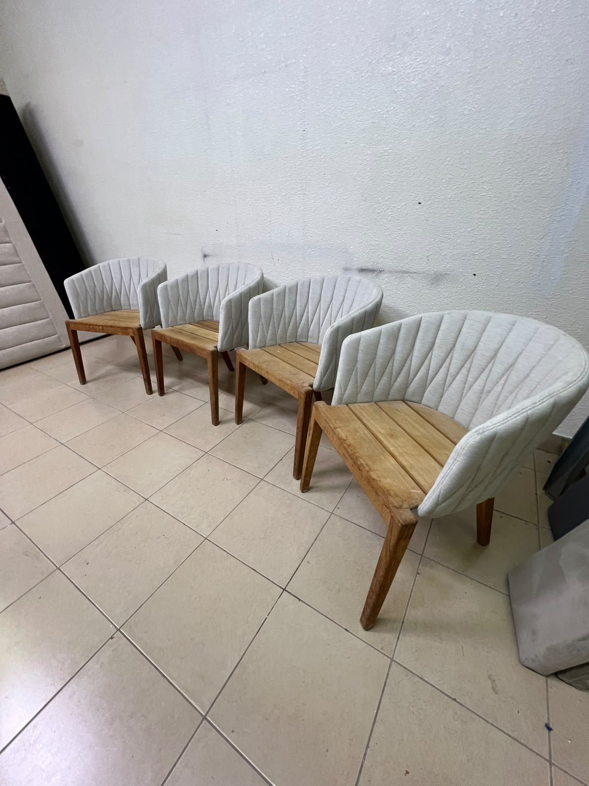 The "Calypso" garden chair by Royal Botania, featuring a solid teak base and an upholstered backrest with a unique design incorporating vertical stitching. - Image 7