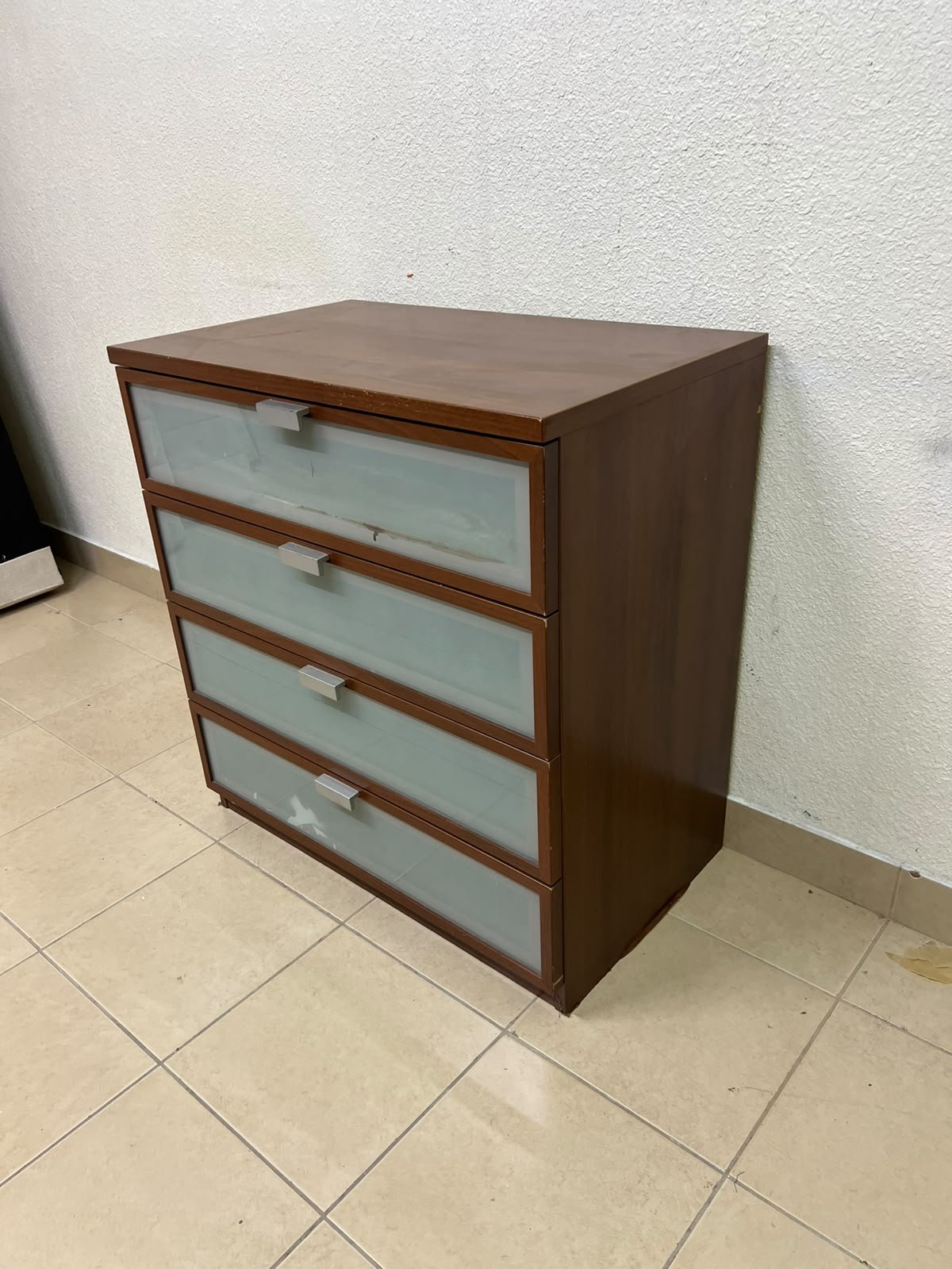 The IKEA HOPEN dark wood chest of drawers features four drawers with frosted glass fronts and silver-colored handles. - Image 4