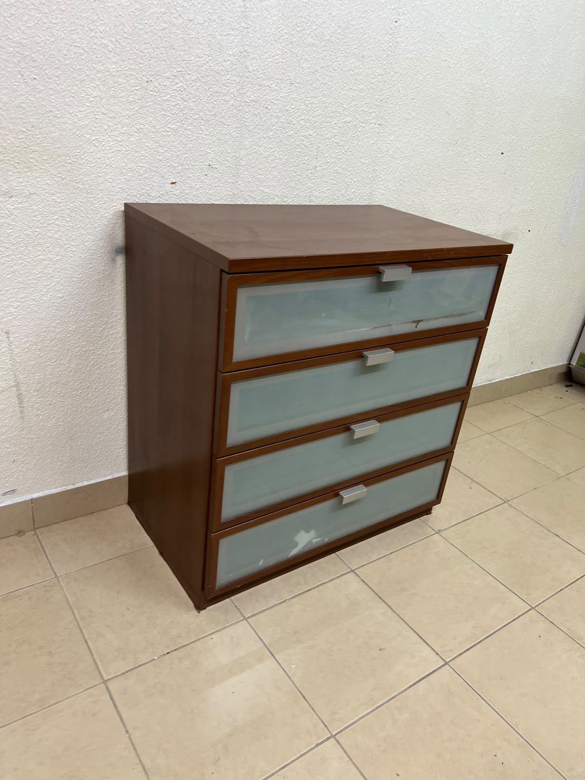 The IKEA HOPEN dark wood chest of drawers features four drawers with frosted glass fronts and silver-colored handles. - Image 6