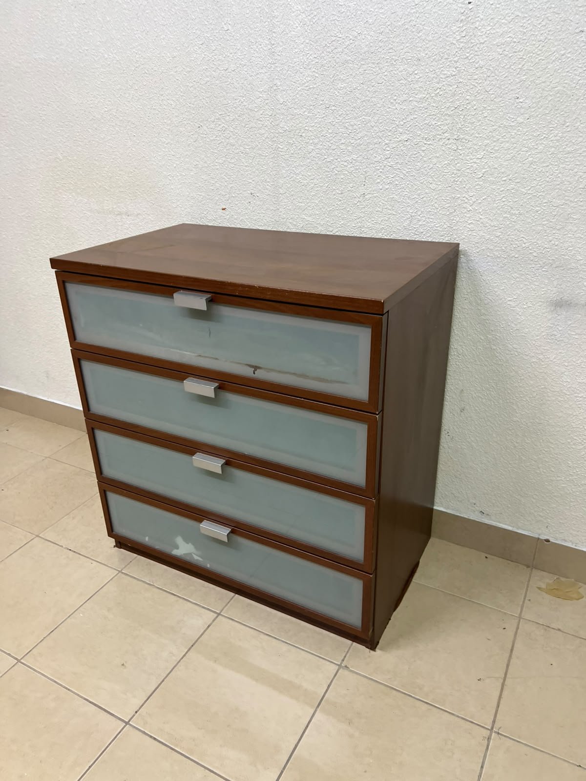 The IKEA HOPEN dark wood chest of drawers features four drawers with frosted glass fronts and silver-colored handles. - Image 9
