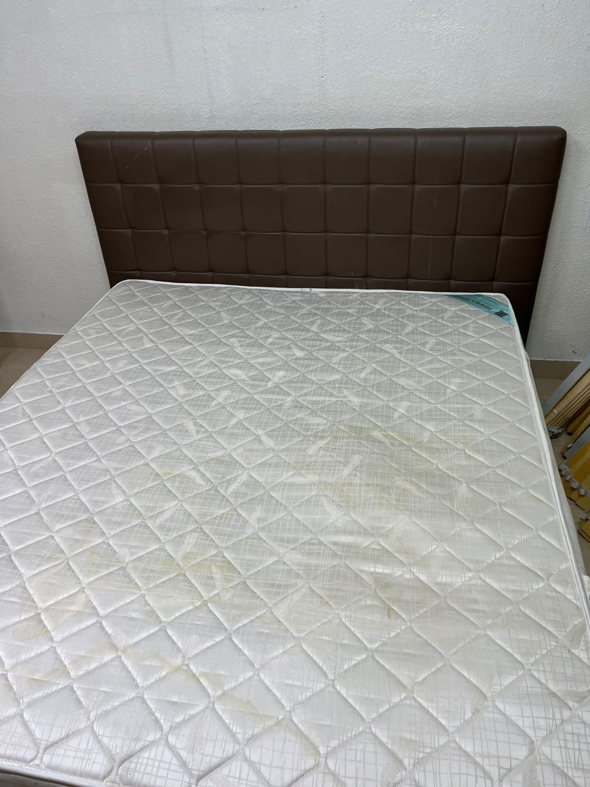 A modern white wooden king-size bed, paired with a cushioned spring mattress and a brown faux-leather upholstered headboard. - Image 6
