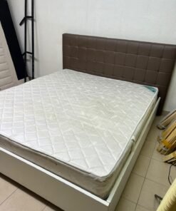 A modern white wooden king-size bed, paired with a cushioned spring mattress and a brown faux-leather upholstered headboard. - Image 8