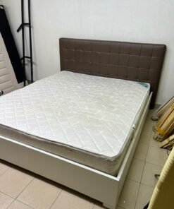 A modern white wooden king-size bed, paired with a cushioned spring mattress and a brown faux-leather upholstered headboard. - Image 7