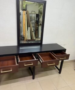 An ultra-long, modern console or vanity table featuring a black wooden frame, contrasting warm-toned wooden drawers, and gold-finished metal handles; it comes with a matching wall mirror. - Image 2