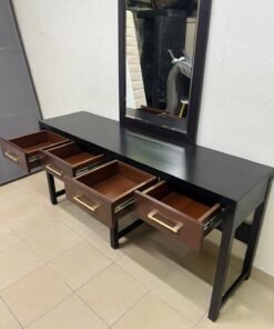 An ultra-long, modern console or vanity table featuring a black wooden frame, contrasting warm-toned wooden drawers, and gold-finished metal handles; it comes with a matching wall mirror. - Image 4