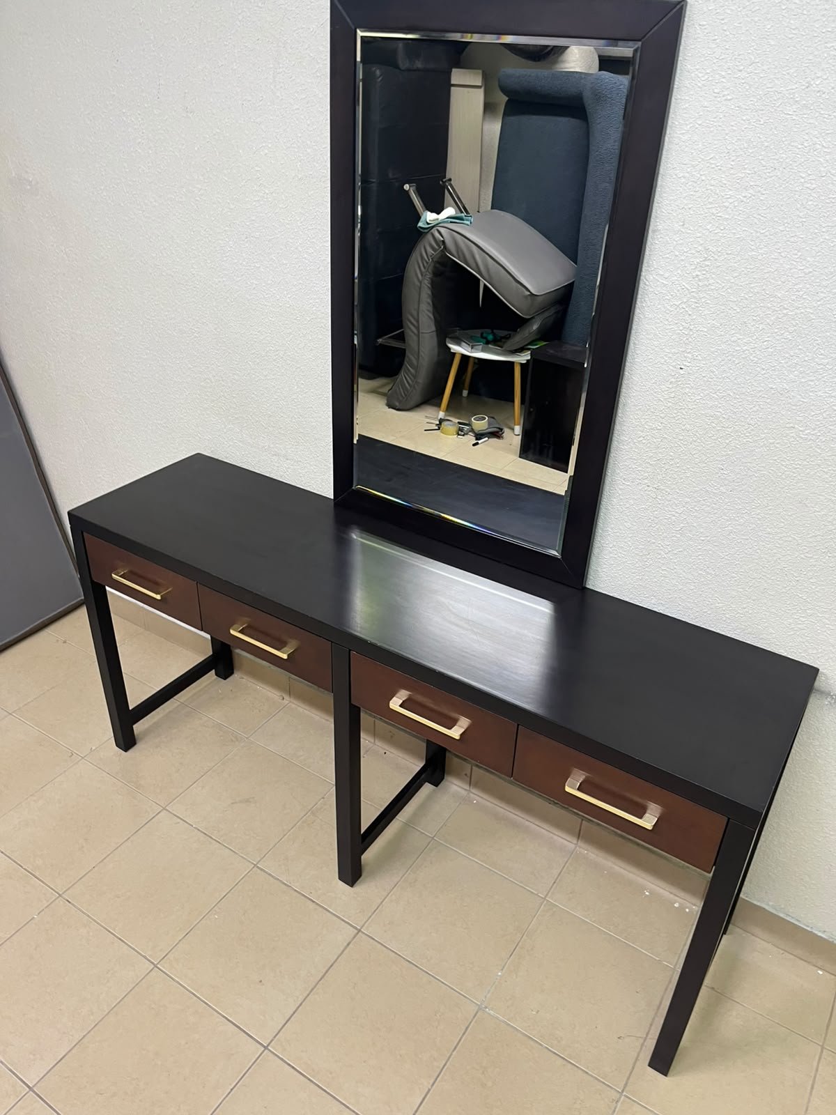 An ultra-long, modern console or vanity table featuring a black wooden frame, contrasting warm-toned wooden drawers, and gold-finished metal handles; it comes with a matching wall mirror. - Image 8