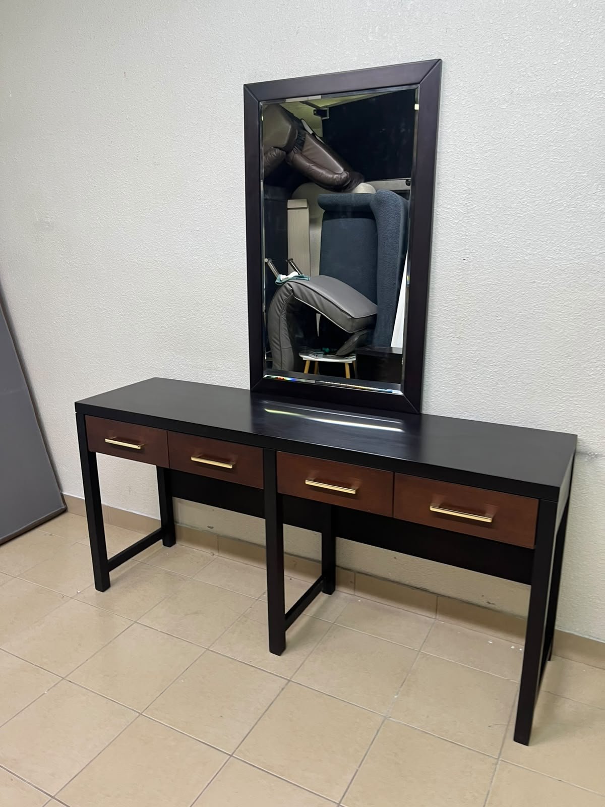 An ultra-long, modern console or vanity table featuring a black wooden frame, contrasting warm-toned wooden drawers, and gold-finished metal handles; it comes with a matching wall mirror. - Image 10