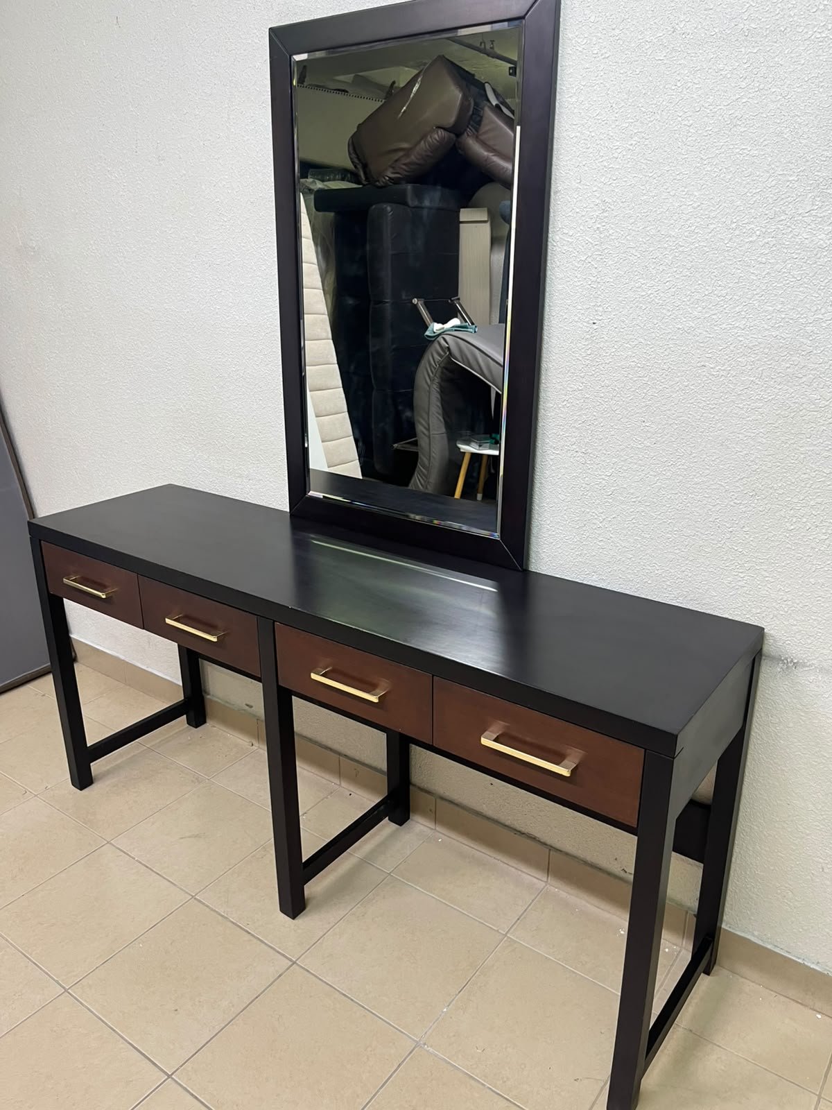 An ultra-long, modern console or vanity table featuring a black wooden frame, contrasting warm-toned wooden drawers, and gold-finished metal handles; it comes with a matching wall mirror. - Image 15