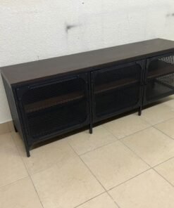 The FJÄLLBO TV unit from IKEA, featuring an industrial design with a solid wood top and black metal mesh doors. - Image 7