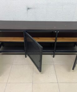 The FJÄLLBO TV unit from IKEA, featuring an industrial design with a solid wood top and black metal mesh doors. - Image 9