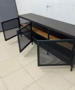 A modern grey faux leather chaise longue featuring an attached round glass side table and metal legs. - Image 2